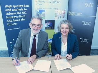 Ian Diamond of the ONS and Karen O'Brien of Durham University sign an agreement